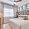 Spacious bedroom with ample natural lighting inside a townhome at Cadia Grand Prairie