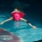 a person swimming in a pool