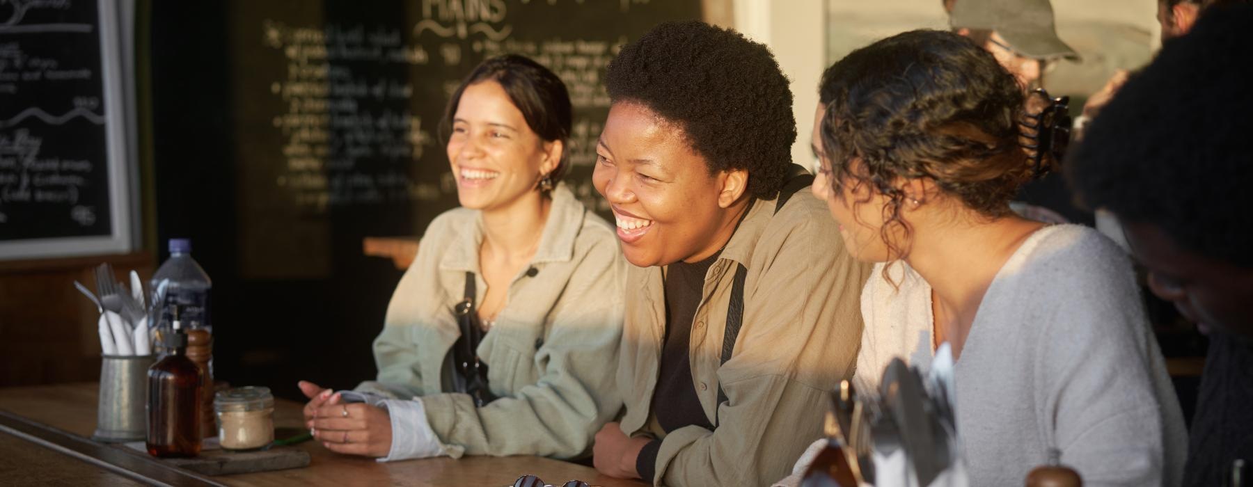 people sitting at a restaurant bar