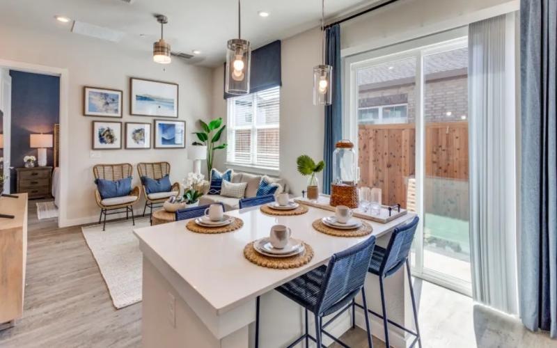 dining area and living room with access to private backyard