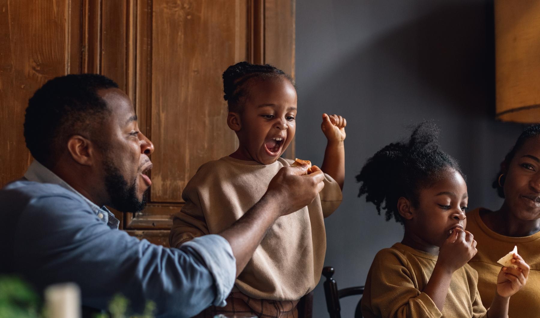 Settle into comfort at Cadia Grand Prairie young family of four eating at a table